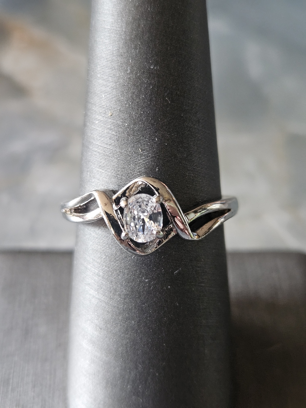 Silver Tone Twisted Band Ring with Oval Clear Stone Bomb Party